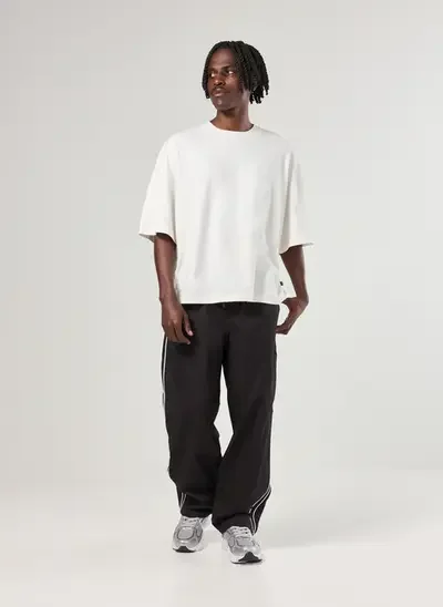 calça super baggy sarja preta com listras